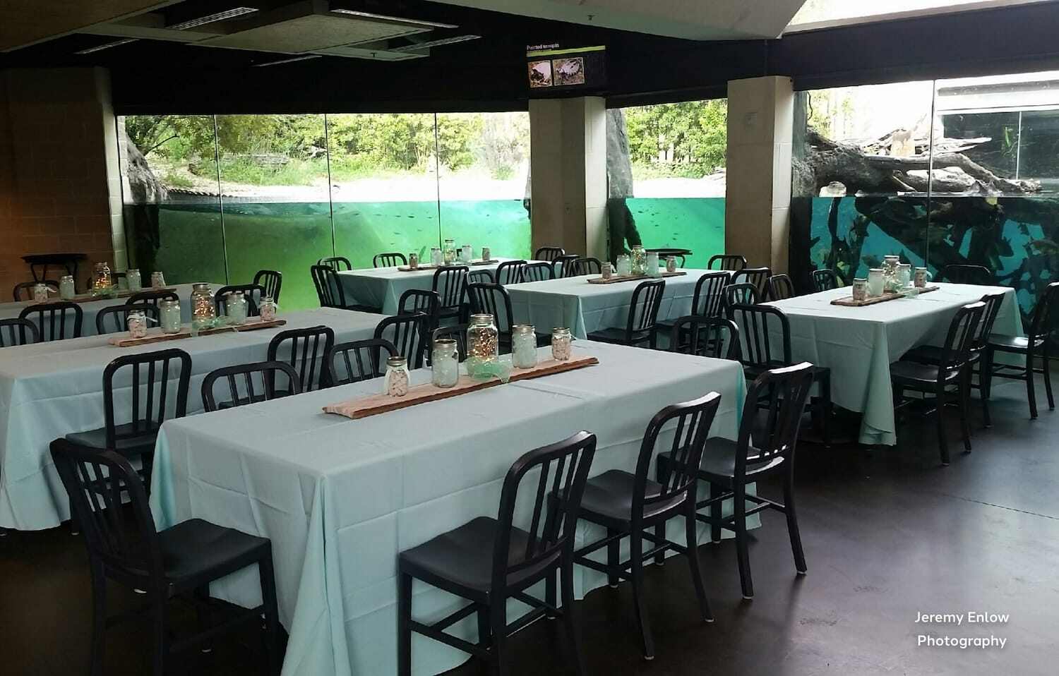 wedding tables next to aquarium